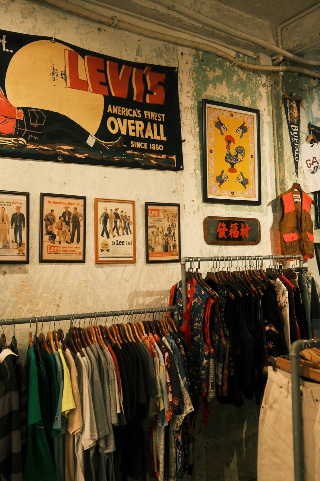 Curated vintage workwear and jackets displayed in a clothing store