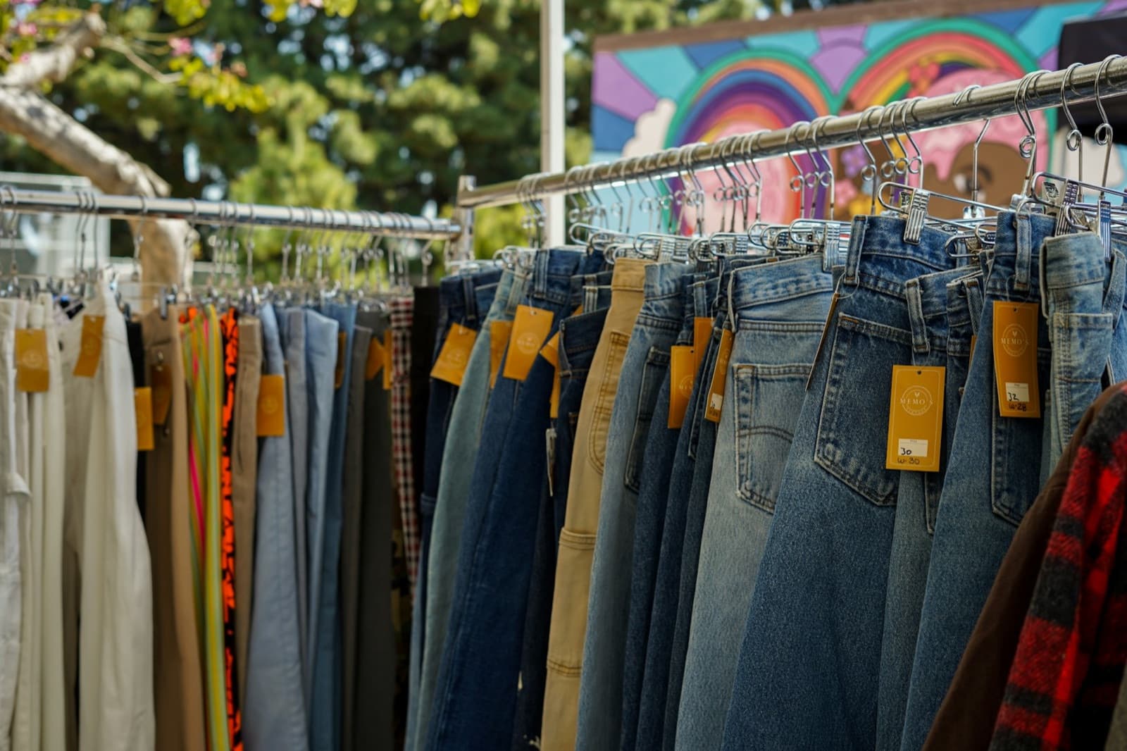 Vintage denim garments displayed on a clothing rack