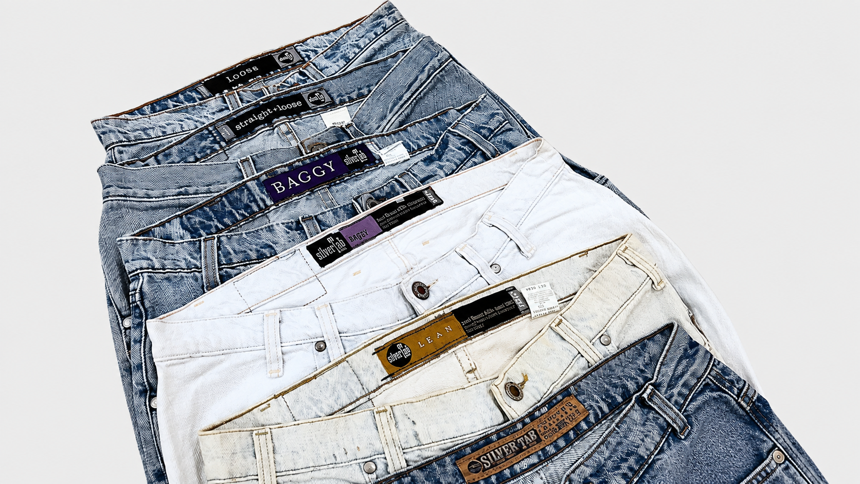 Collection of vintage denim jeans in blue white and cream colors