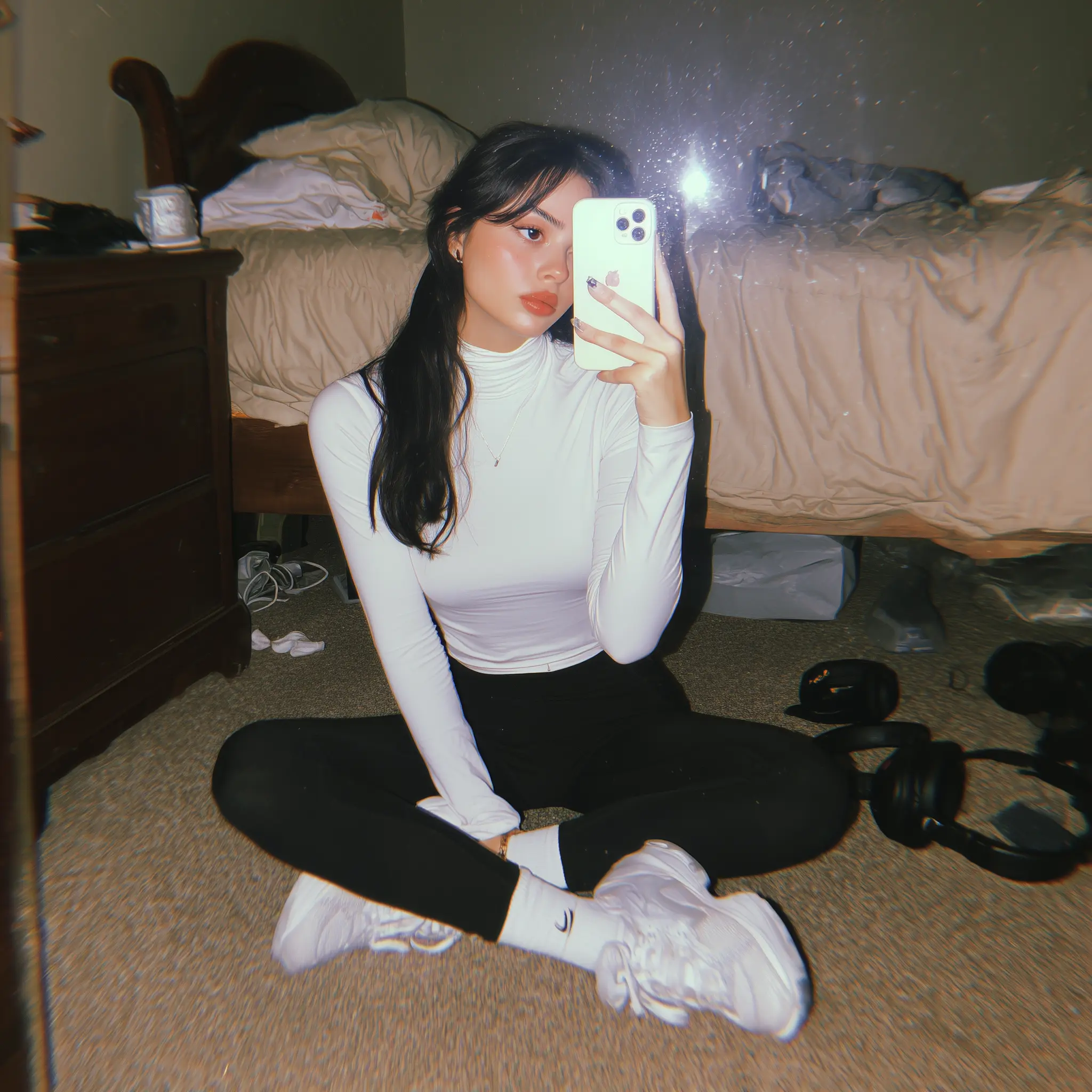 u4811196382_A_young_woman_sitting_cross-legged_on_the_floor_of__8d208d63-0a9d-41b2-889e-5995c49bf514