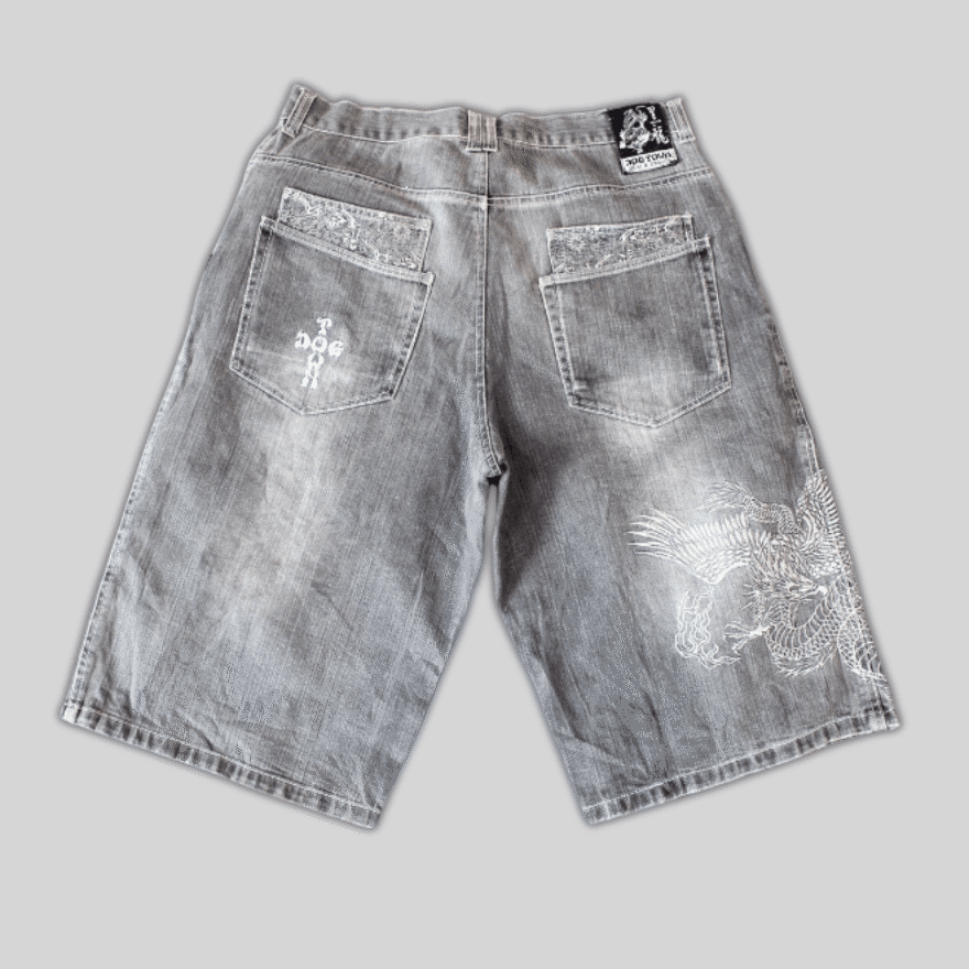 1Vintage-JNCO-Dogtown-jorts-featuring-a-baggy-fit-embroidered-fire-breathing-dragon-and-a-nod-to-90s-skateboarding-culture-1.png